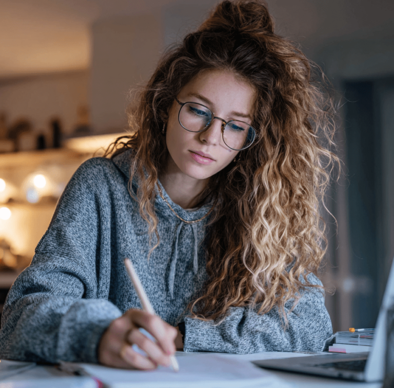 Student studying at home preparing to retake the SAT